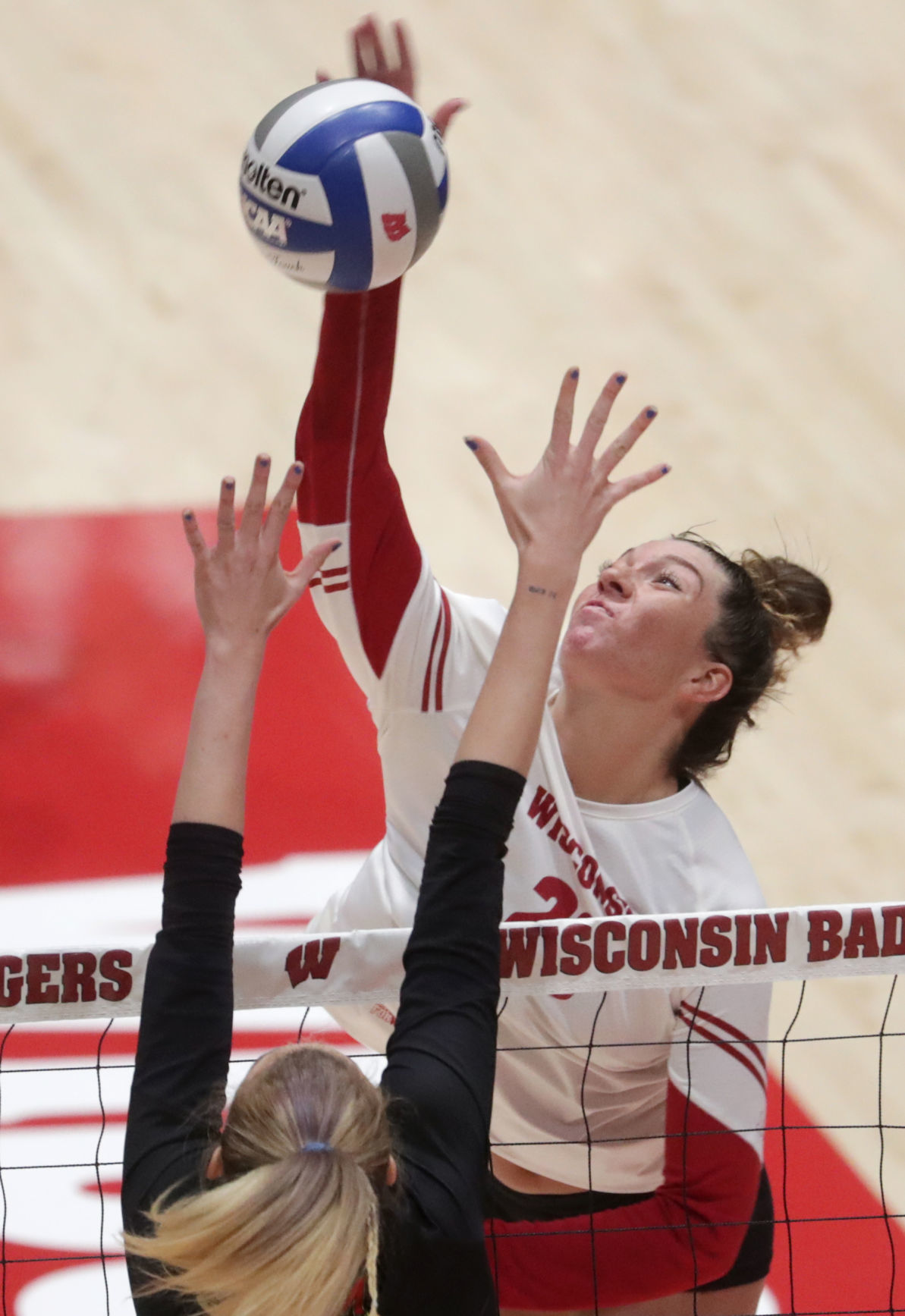 Wisconsin competes against Maryland in a women's volleyball match at the UW Field House